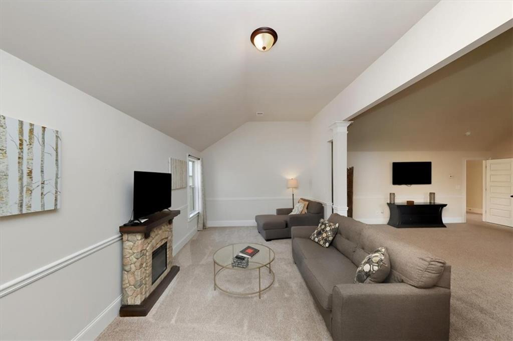 4058 Rosebay Way Southwest Conyers, GA 30094 - Photo 31 of 55 a living room with furniture and a flat screen tv