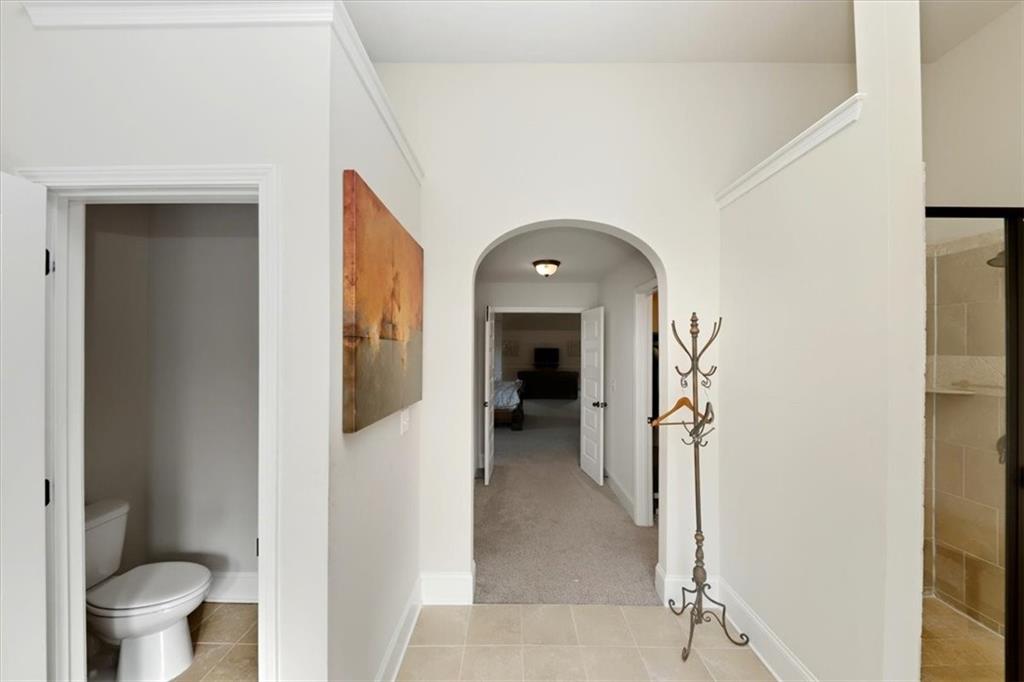 4058 Rosebay Way Southwest Conyers, GA 30094 - Photo 33 of 55 a view of a hallway view with wooden floor and a bathroom