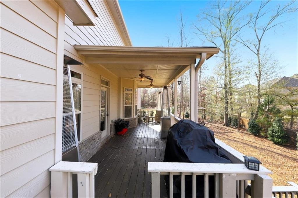 4058 Rosebay Way Southwest Conyers, GA 30094 - Photo 38 of 55 a view of a patio with table and chairs and wooden floor