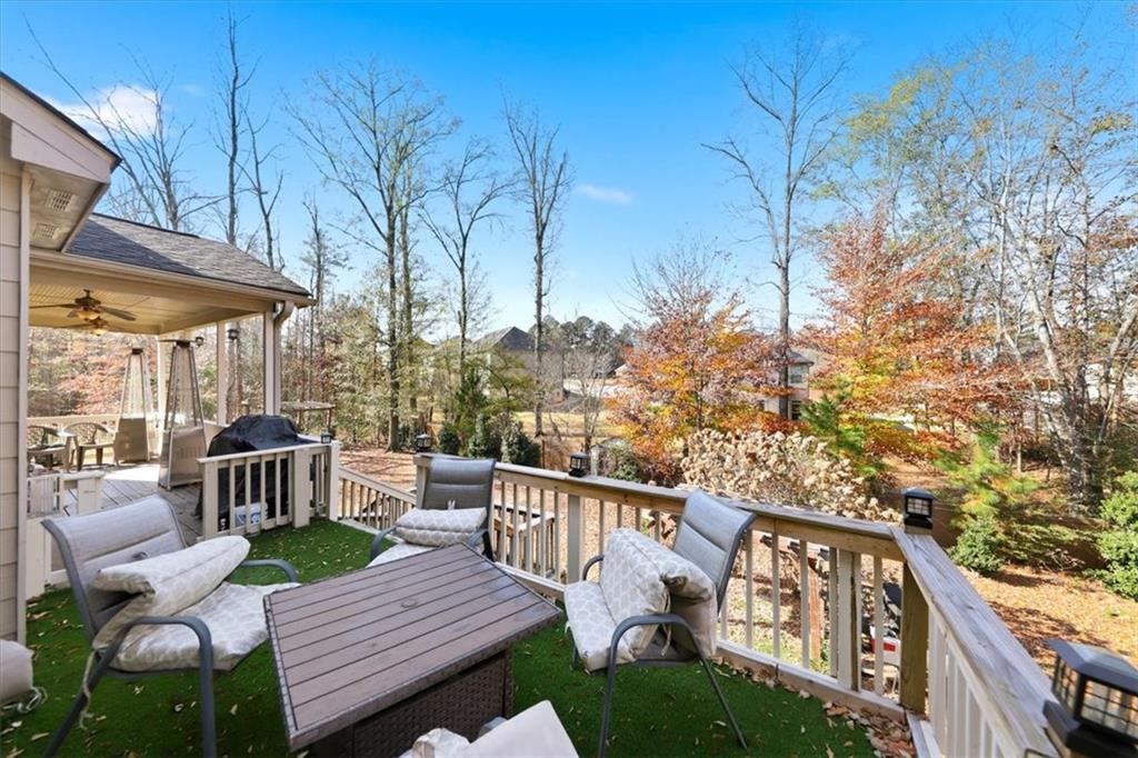 4058 Rosebay Way Southwest Conyers, GA 30094 - Photo 39 of 55 a view of a wooden chairs and table in the balcony