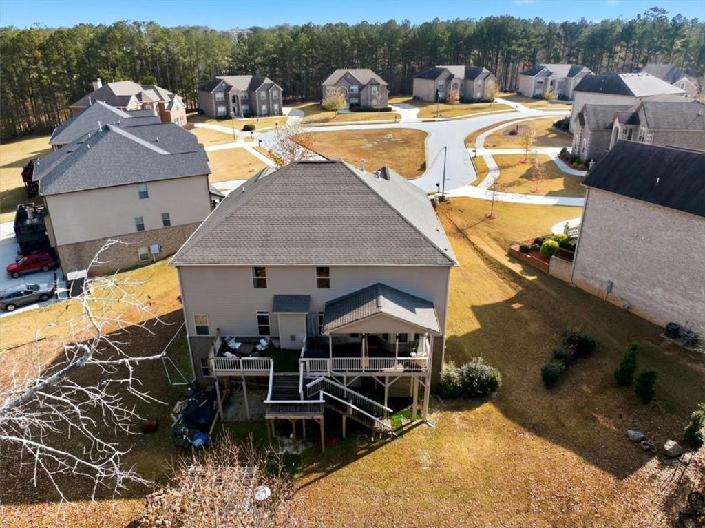 4058 Rosebay Way Southwest Conyers, GA 30094 - Photo 49 of 55 an aerial view of a house with swimming pool