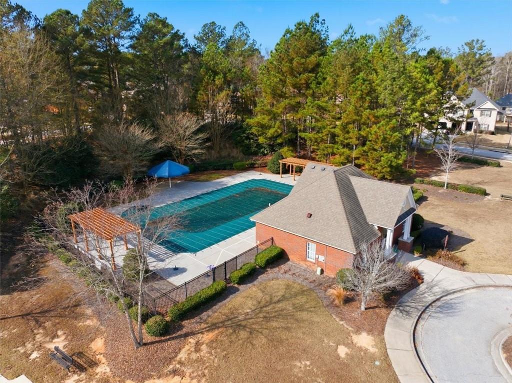 4058 Rosebay Way Southwest Conyers, GA 30094 - Photo 54 of 55 an aerial view of a house with garden space and street view