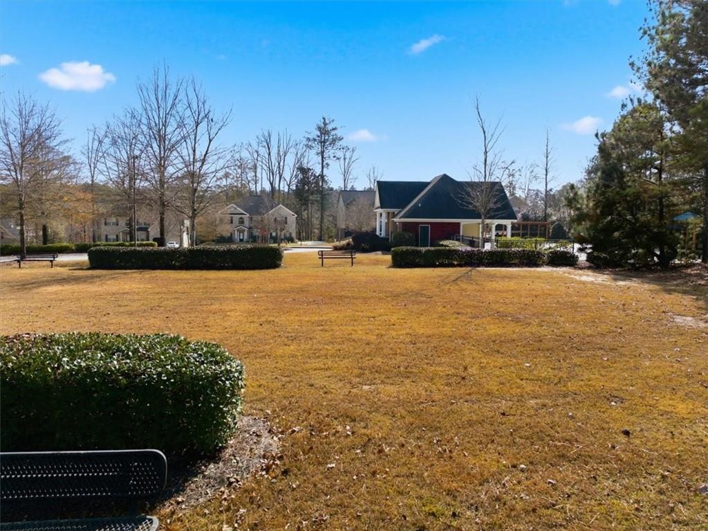 4058 Rosebay Way Southwest Conyers, GA 30094 - Photo 55 of 55 a swimming pool with outdoor seating and yard