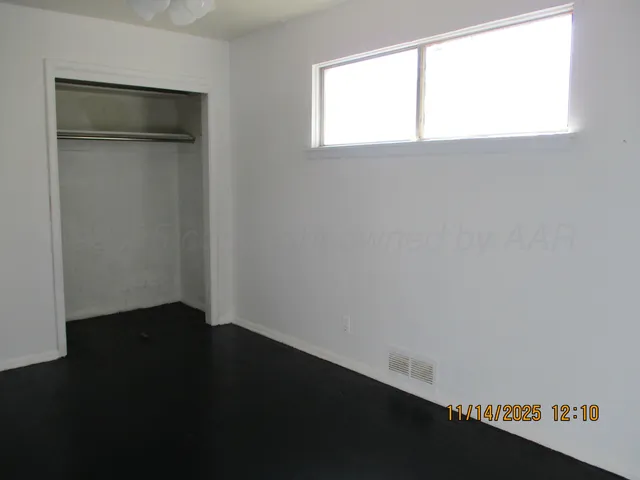 a view of an empty room with a window