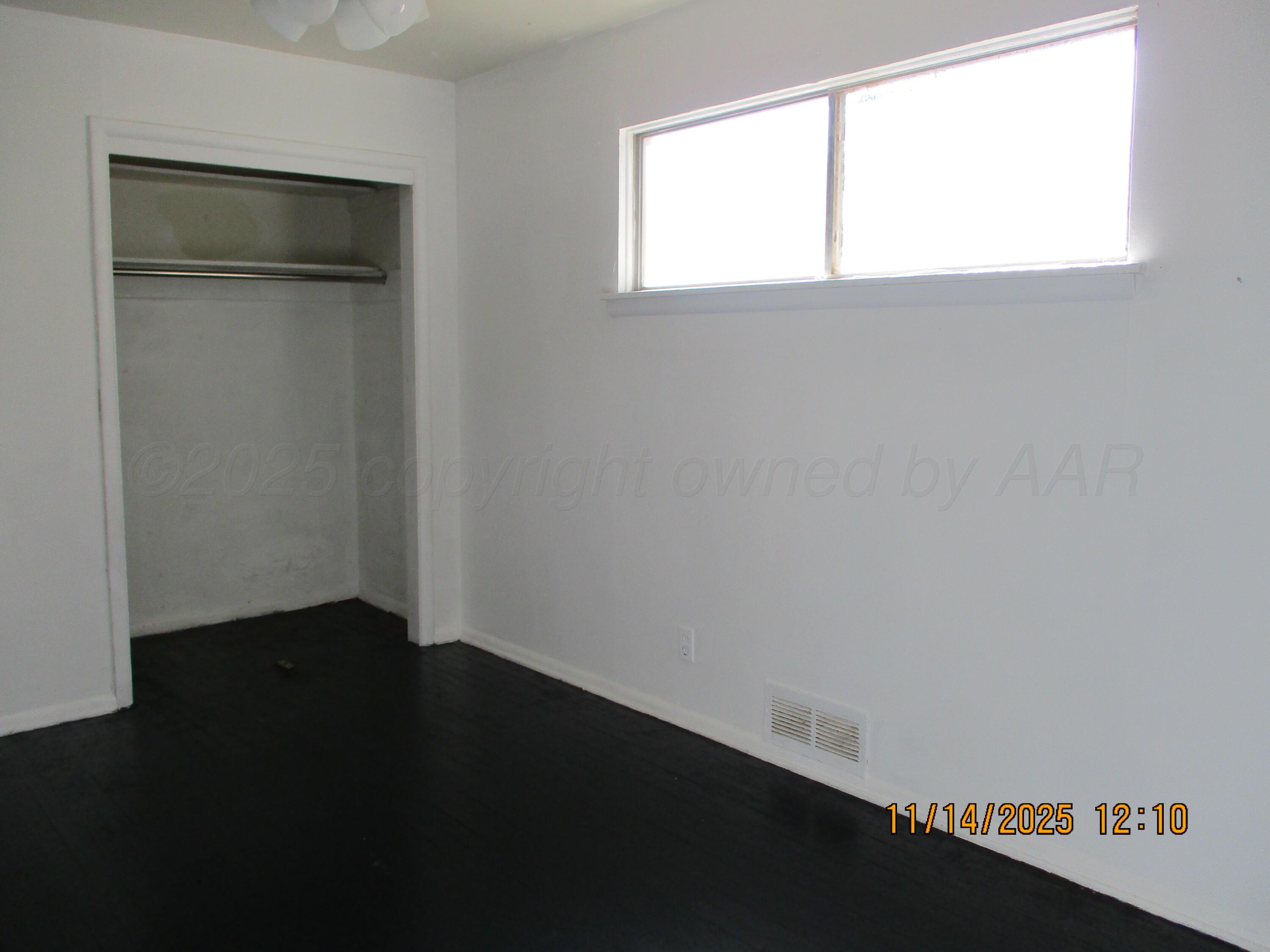 211 Southwest 34th Avenue Amarillo, TX 79109 - Photo 6 of 10 a view of an empty room with a window