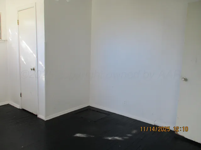 a view of small space with wooden floor