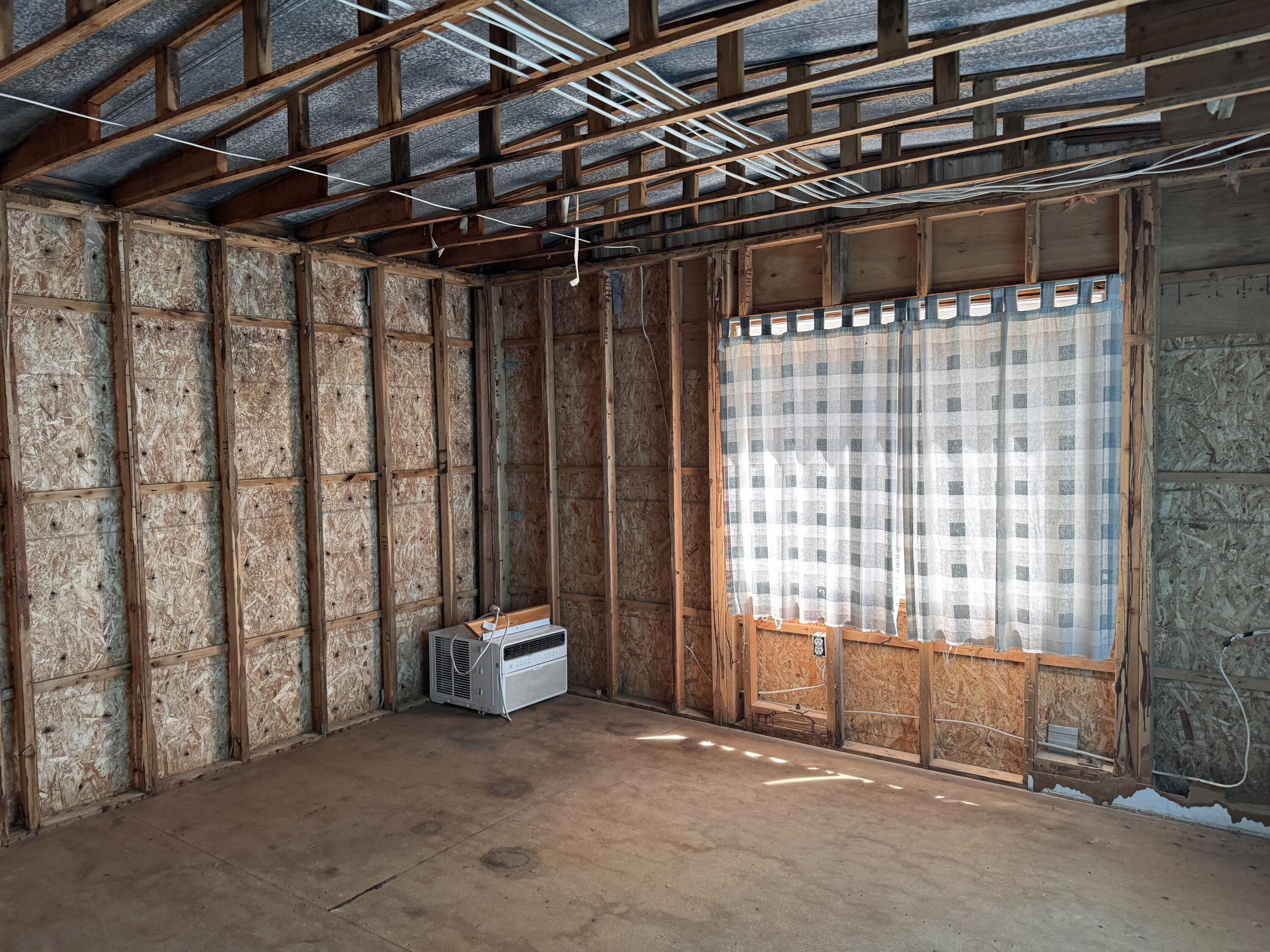 34614 Sprague River Road Sprague River, OR 97639 - Photo 16 of 24 a view of an empty room with wooden walls