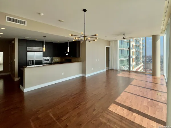 a view of a kitchen with a sink and a window