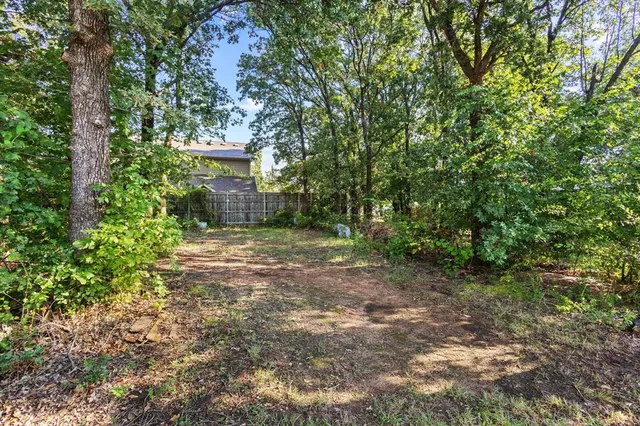 a view of a house with a tree