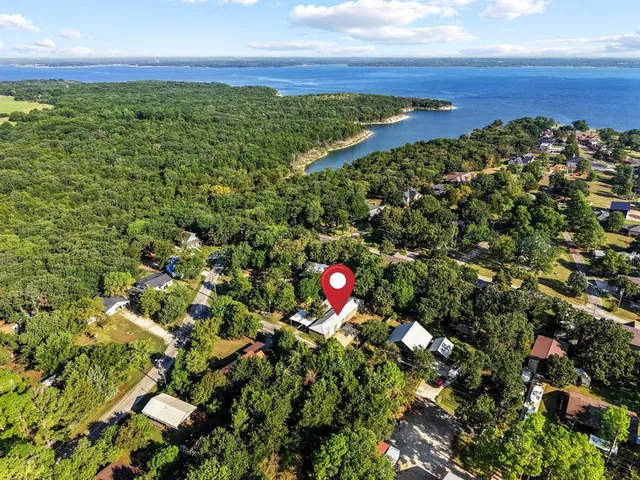 a view of a field with an ocean