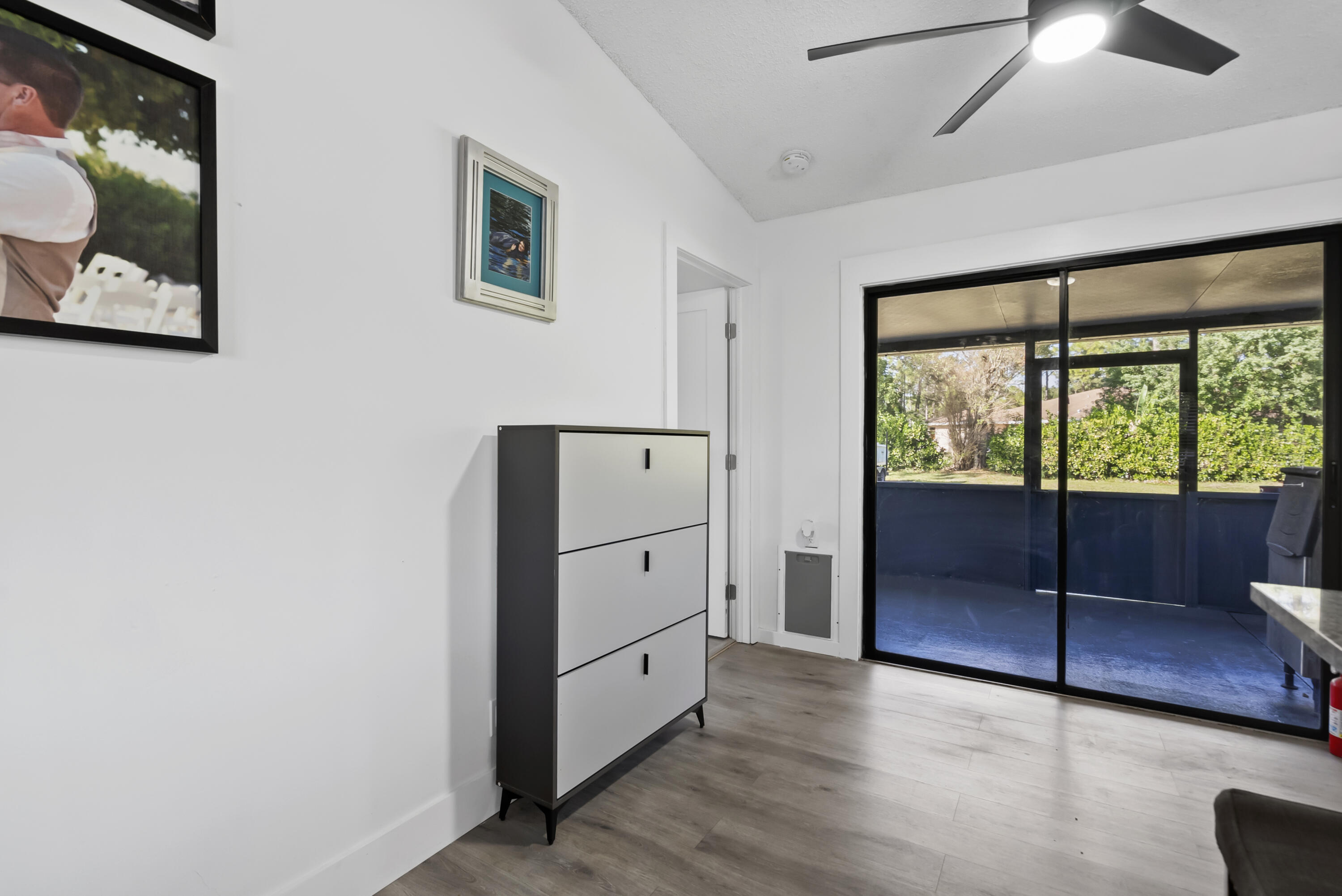 17493 41st Road North The Acreage, FL 33470 - Photo 15 of 45 a view of hallway with window and wooden floor