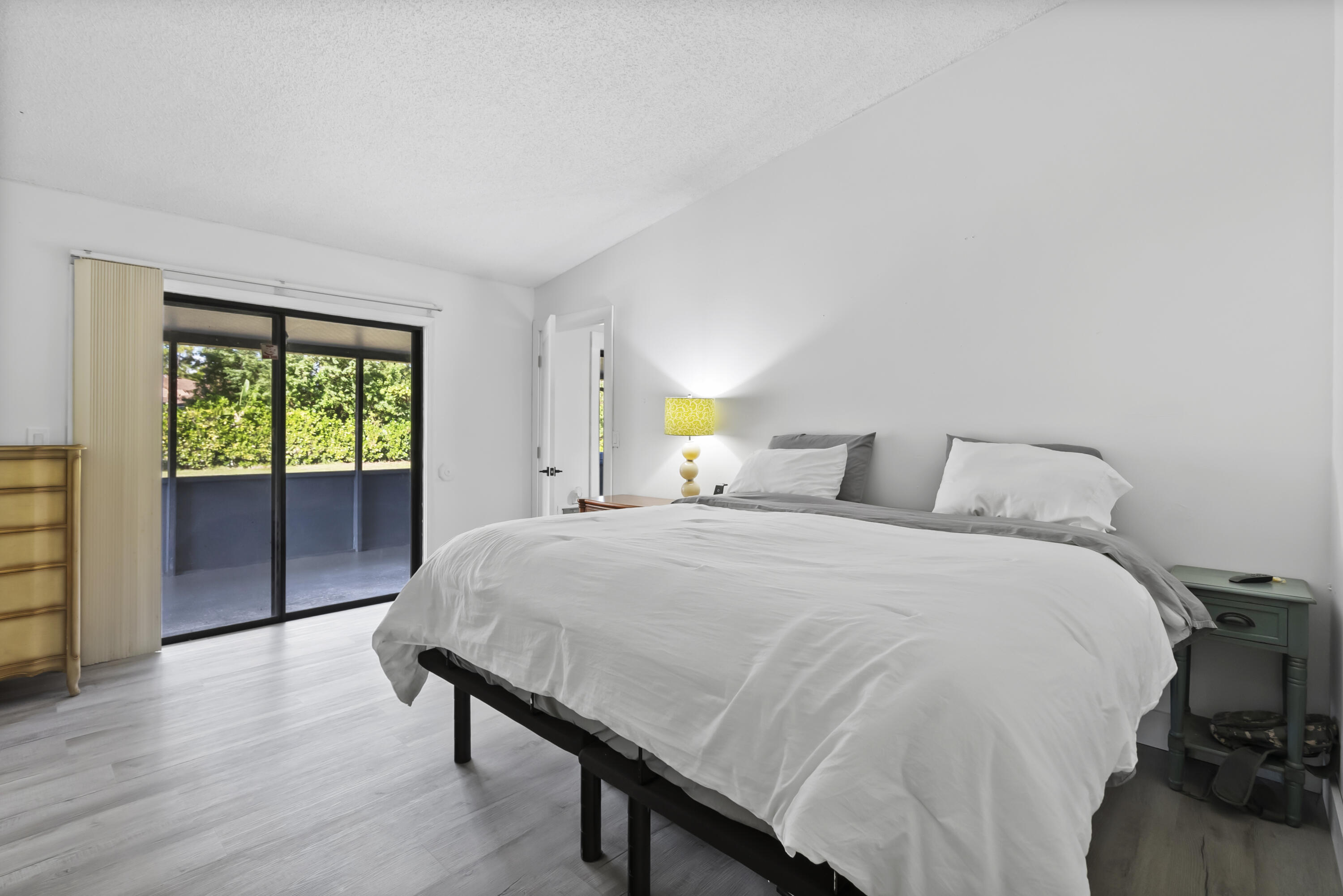 17493 41st Road North The Acreage, FL 33470 - Photo 17 of 45 a bedroom with a bed and wooden floor