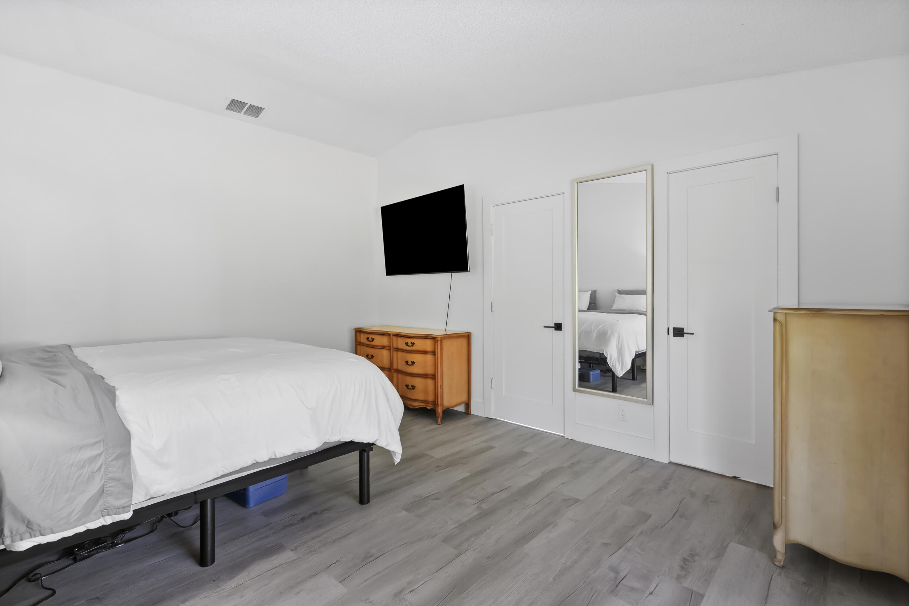 17493 41st Road North The Acreage, FL 33470 - Photo 18 of 45 a bedroom with a bed and a television