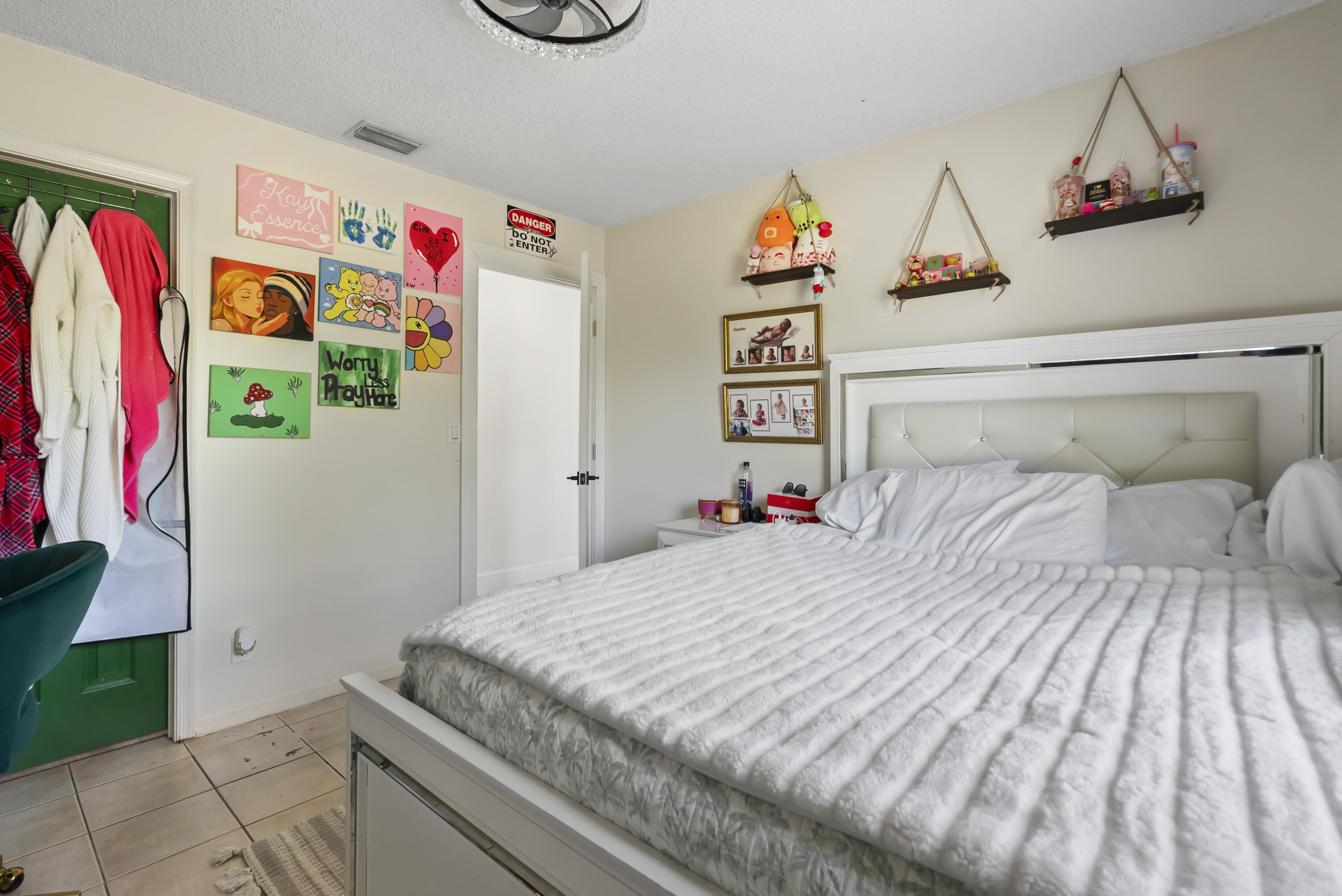 17493 41st Road North The Acreage, FL 33470 - Photo 26 of 45 a bedroom with a bed and a window