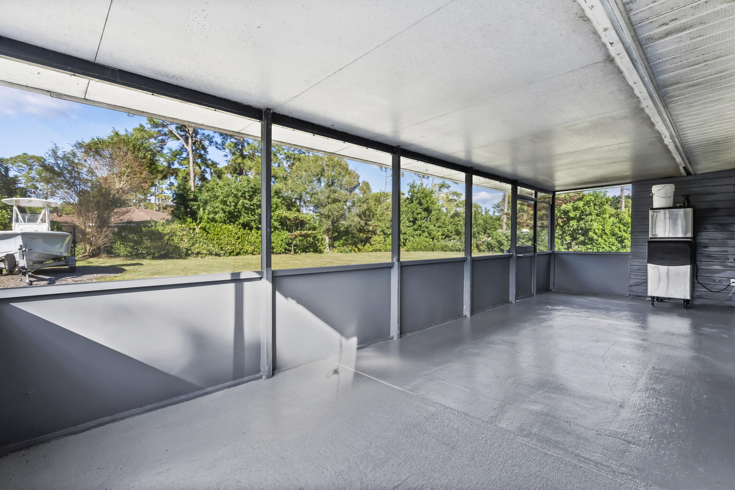 17493 41st Road North The Acreage, FL 33470 - Photo 29 of 45 a view of an empty room with a large window