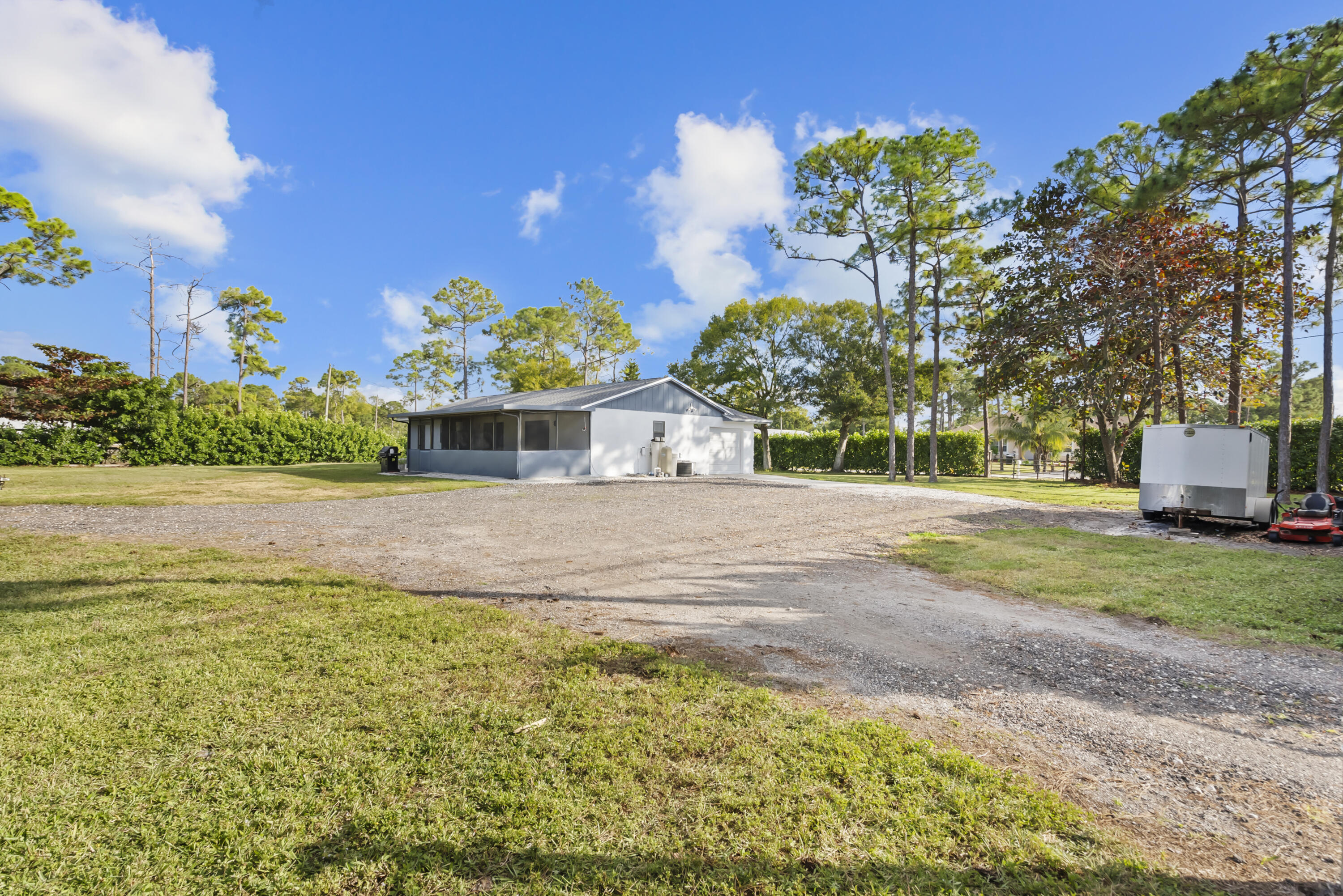 17493 41st Road North The Acreage, FL 33470 - Photo 39 of 45 a house view with a garden space
