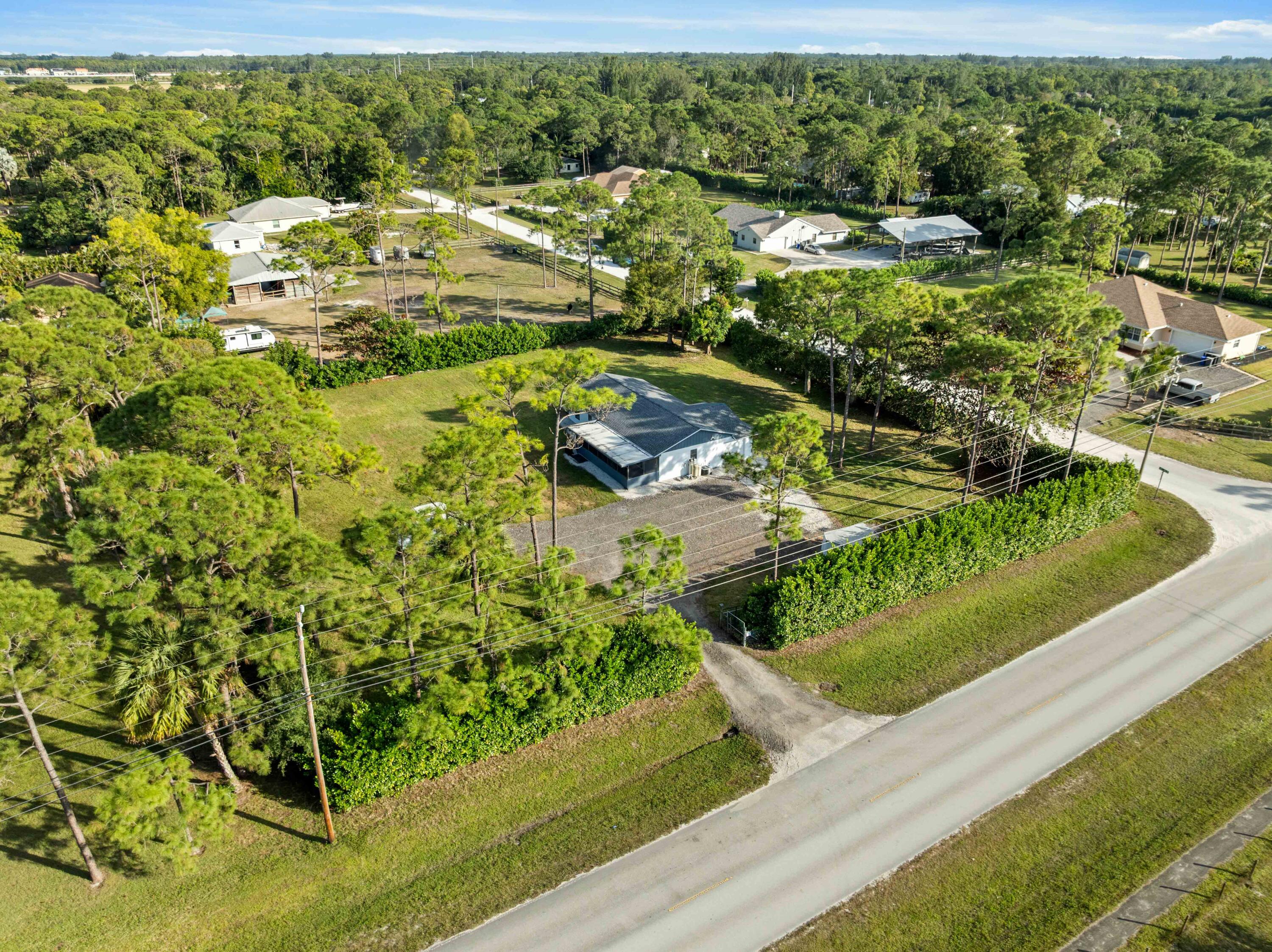17493 41st Road North The Acreage, FL 33470 - Photo 41 of 45 a view of a garden with an outdoor space