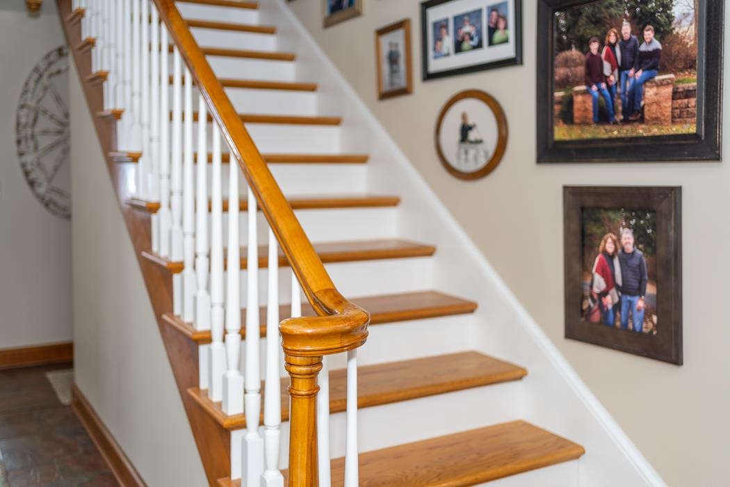 205 Cattle Scales Road Waynesboro, VA 22980 - Photo 21 of 75 a view of staircase with lots of frames on wall and a clock
