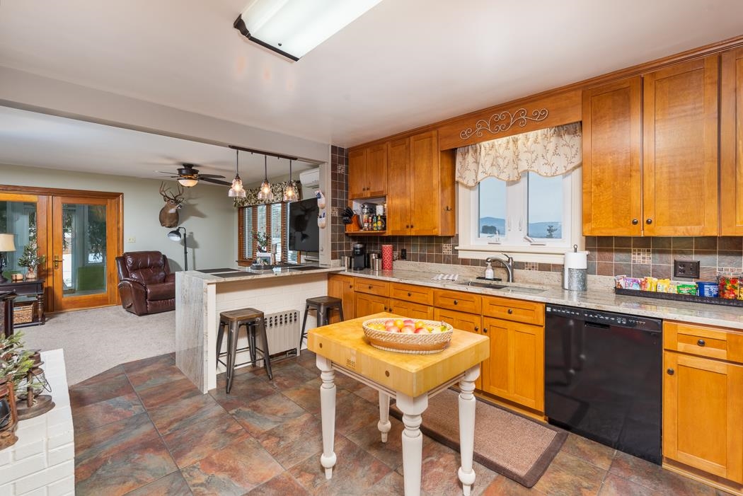 205 Cattle Scales Road Waynesboro, VA 22980 - Photo 29 of 75 a large kitchen with a table and chairs in it