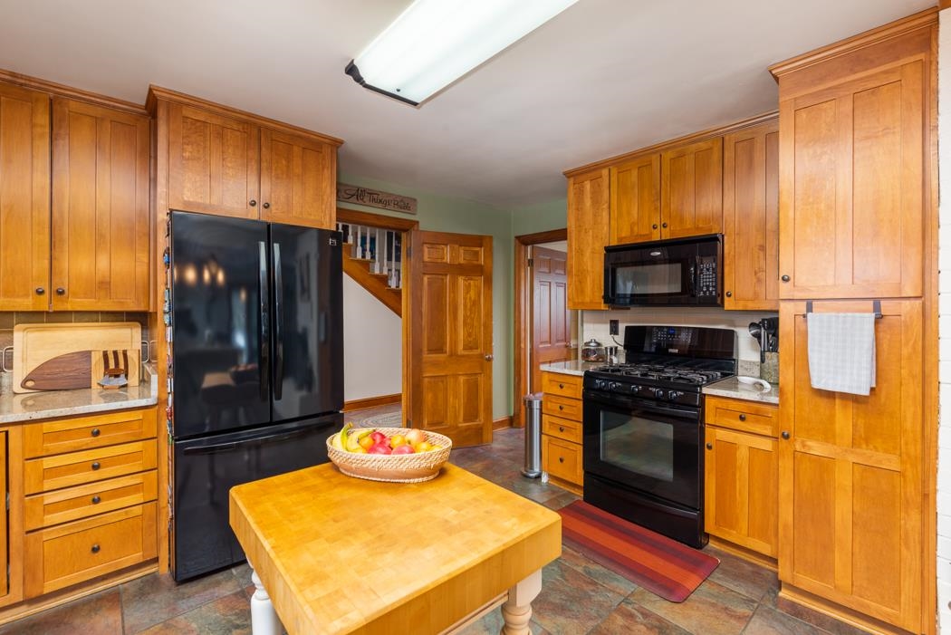 205 Cattle Scales Road Waynesboro, VA 22980 - Photo 30 of 75 a kitchen with stainless steel appliances granite countertop a stove a refrigerator and a stove top oven