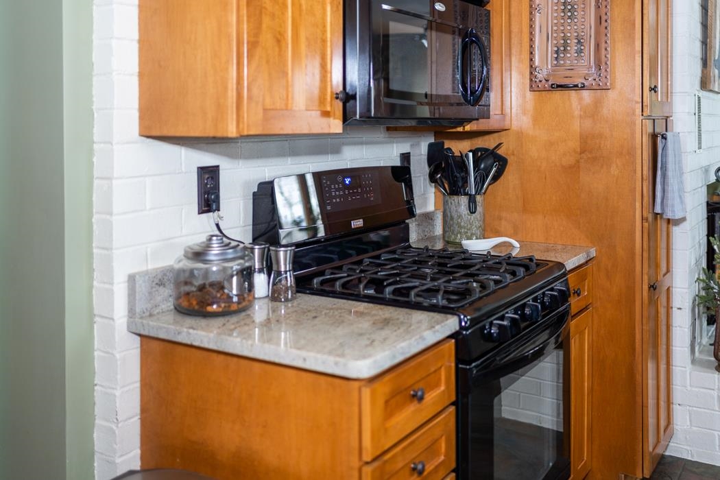 205 Cattle Scales Road Waynesboro, VA 22980 - Photo 33 of 75 a kitchen with granite countertop a stove and a sink
