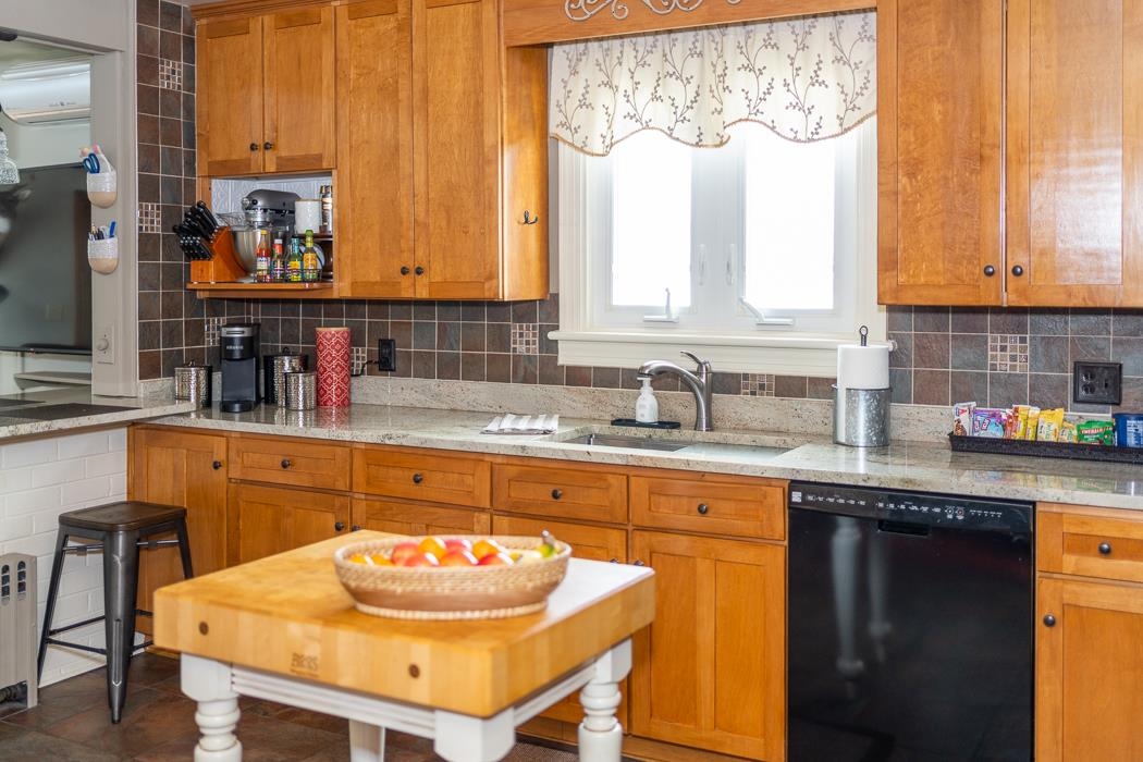 205 Cattle Scales Road Waynesboro, VA 22980 - Photo 36 of 75 a kitchen with stainless steel appliances granite countertop a sink a microwave and white cabinets