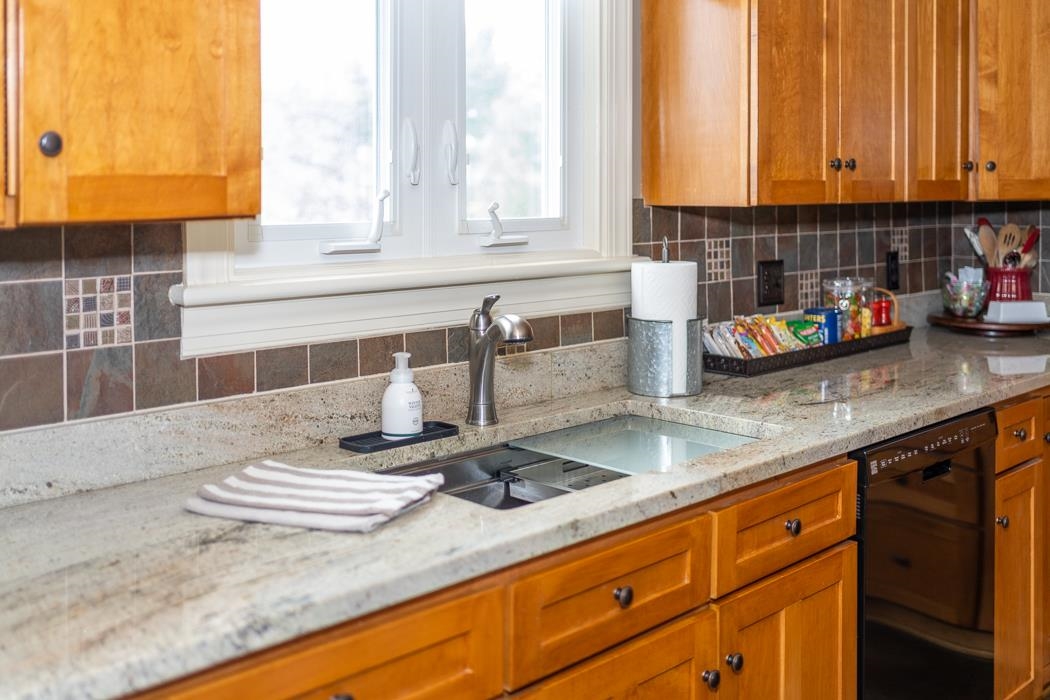 205 Cattle Scales Road Waynesboro, VA 22980 - Photo 38 of 75 a kitchen with stainless steel appliances granite countertop a sink a stove and a wooden cabinets