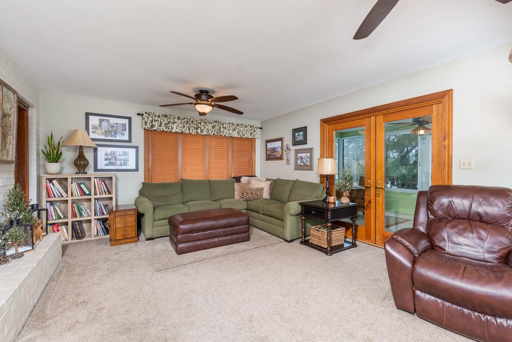 205 Cattle Scales Road Waynesboro, VA 22980 - Photo 44 of 75 a living room with furniture gym equipment and a large window