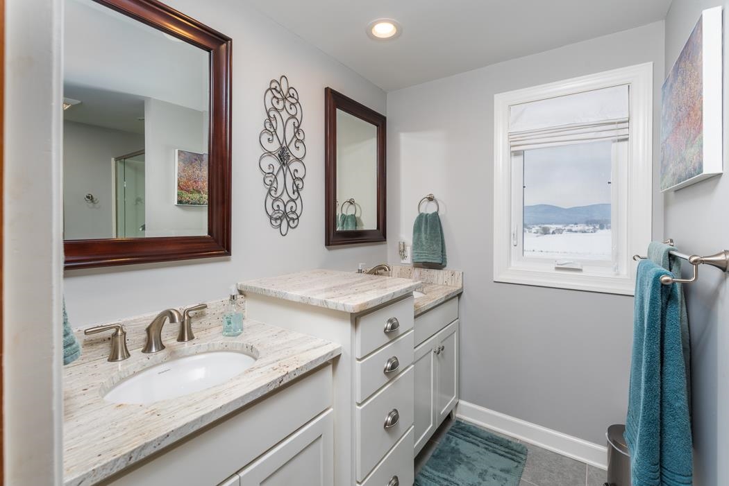 205 Cattle Scales Road Waynesboro, VA 22980 - Photo 51 of 75 a bathroom with a granite countertop sink and a mirror