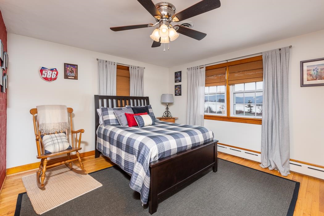 205 Cattle Scales Road Waynesboro, VA 22980 - Photo 54 of 75 a bedroom with a bed and a chandelier