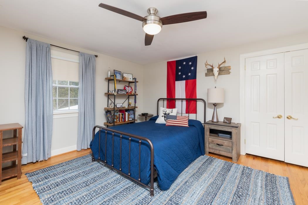 205 Cattle Scales Road Waynesboro, VA 22980 - Photo 58 of 75 a bedroom with a bed and a bookshelf