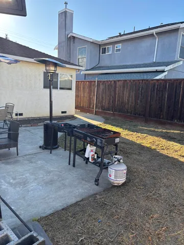 a view of a backyard with sitting area