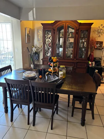 a view of a dining room with furniture and window