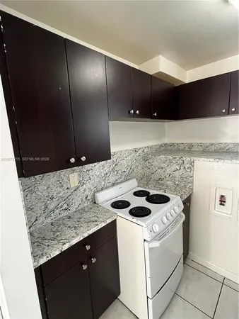 a kitchen with sink cabinets and stove