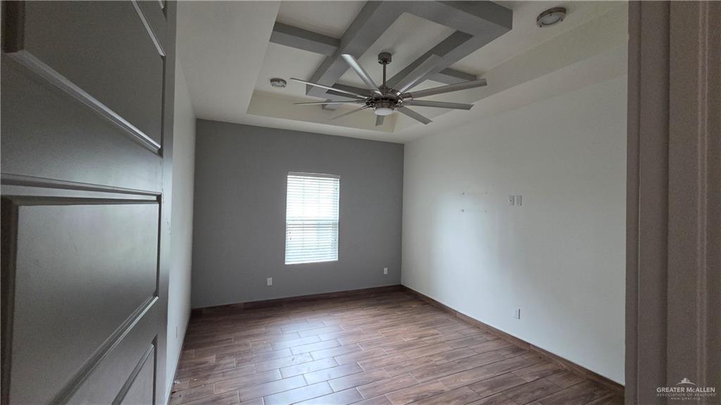 419 North 17th Street, Unit 2 McAllen, TX 78501 - Photo 7 of 10 an empty room with windows and fan