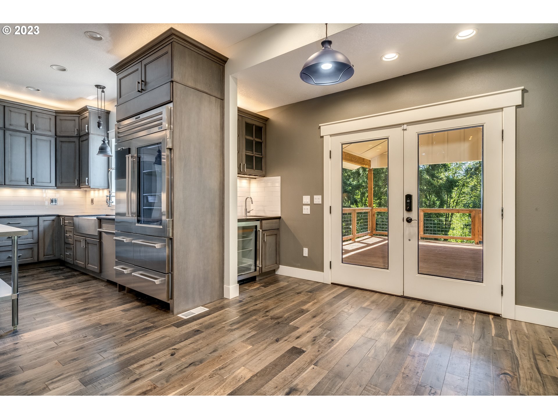 12840 South Carus Road Oregon City, OR 97045 - Photo 11 of 35 a view of kitchen with furniture and wooden floor