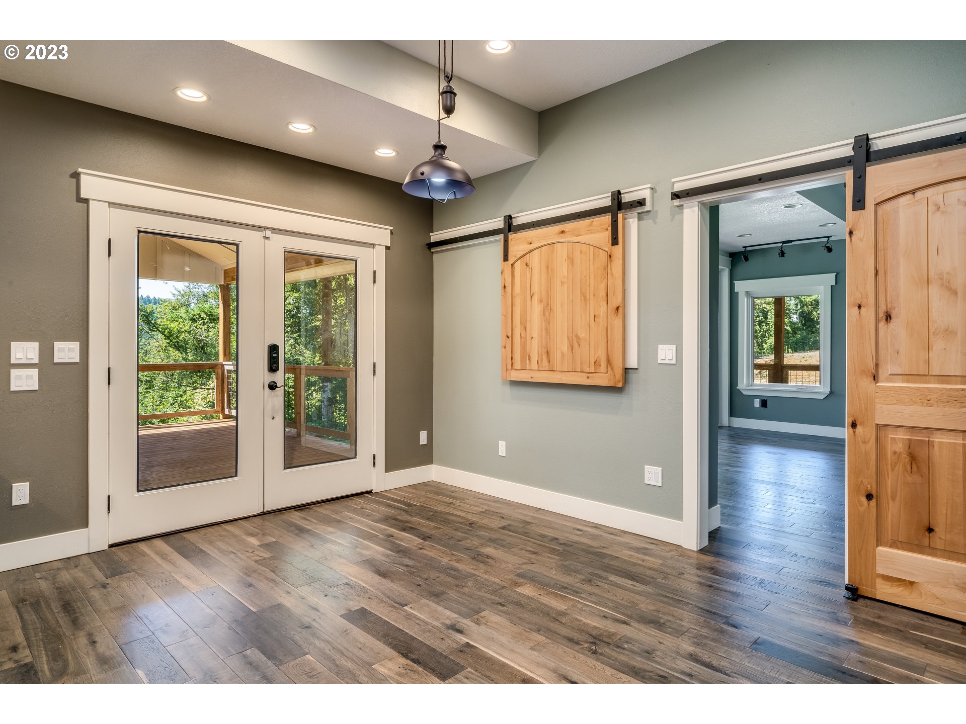 12840 South Carus Road Oregon City, OR 97045 - Photo 13 of 35 a view of an empty room with wooden floor and a window