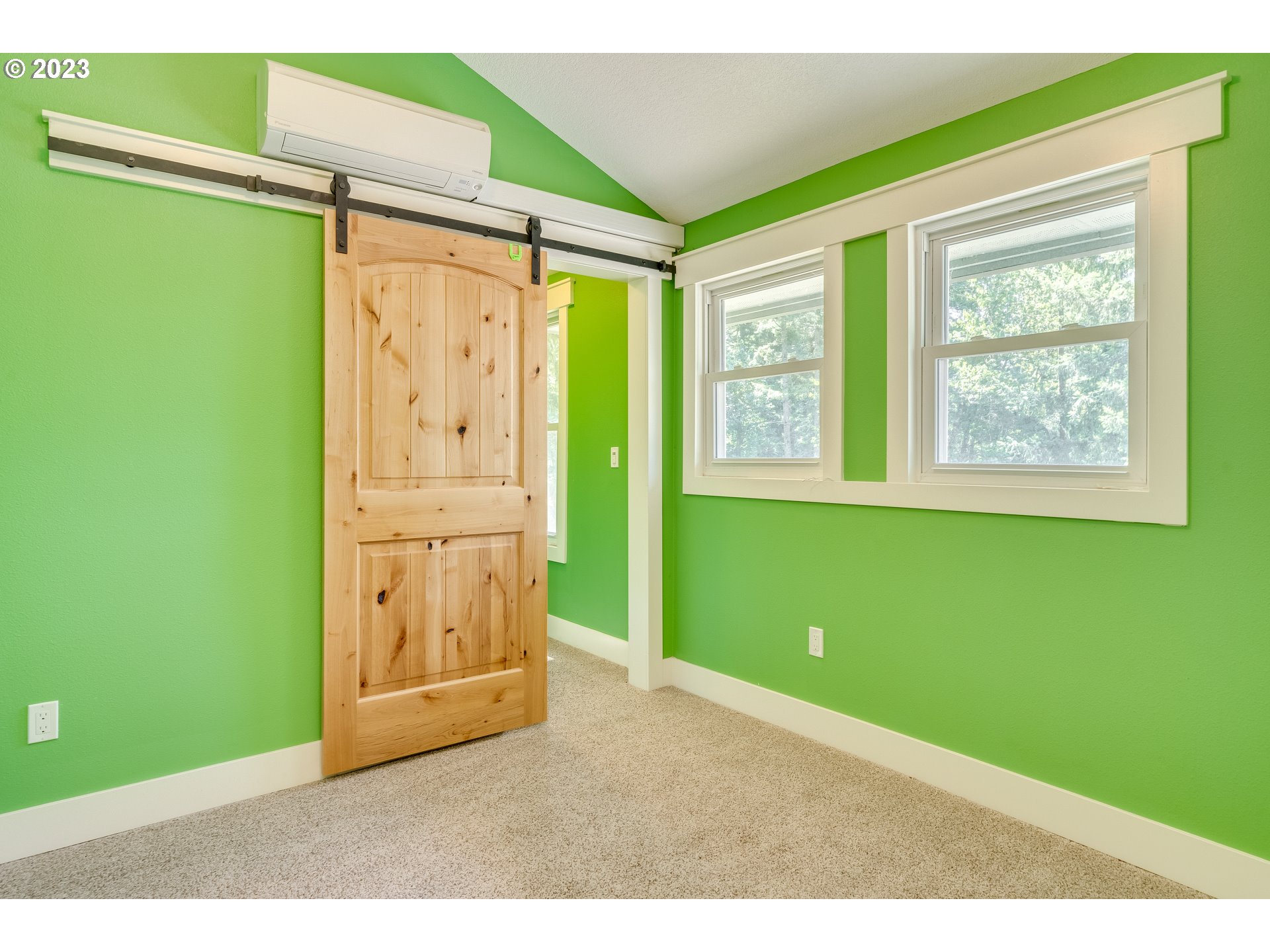 12840 South Carus Road Oregon City, OR 97045 - Photo 27 of 35 a bedroom with a window and a green plant