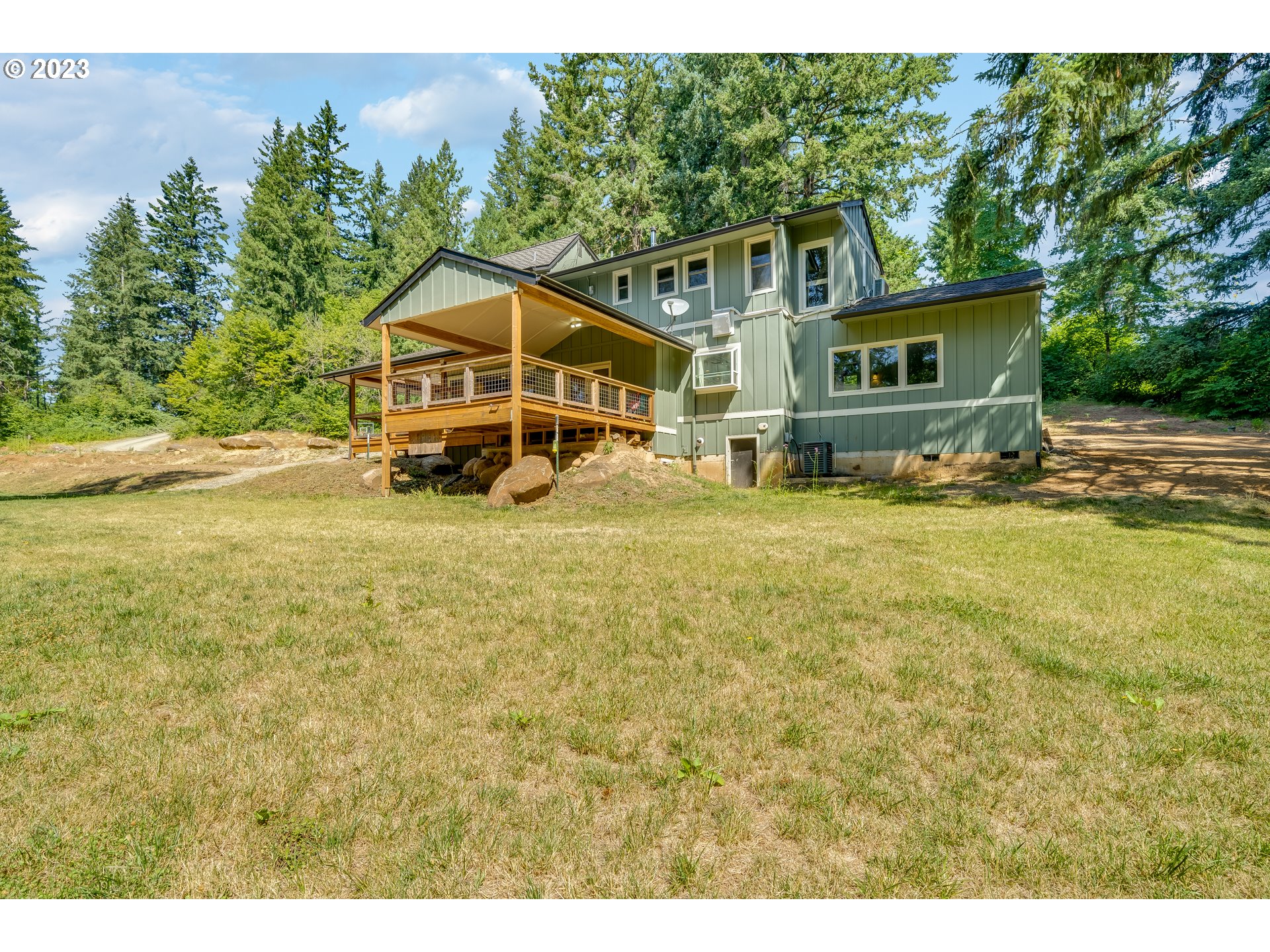 12840 South Carus Road Oregon City, OR 97045 - Photo 31 of 35 a house with a yard in front of it