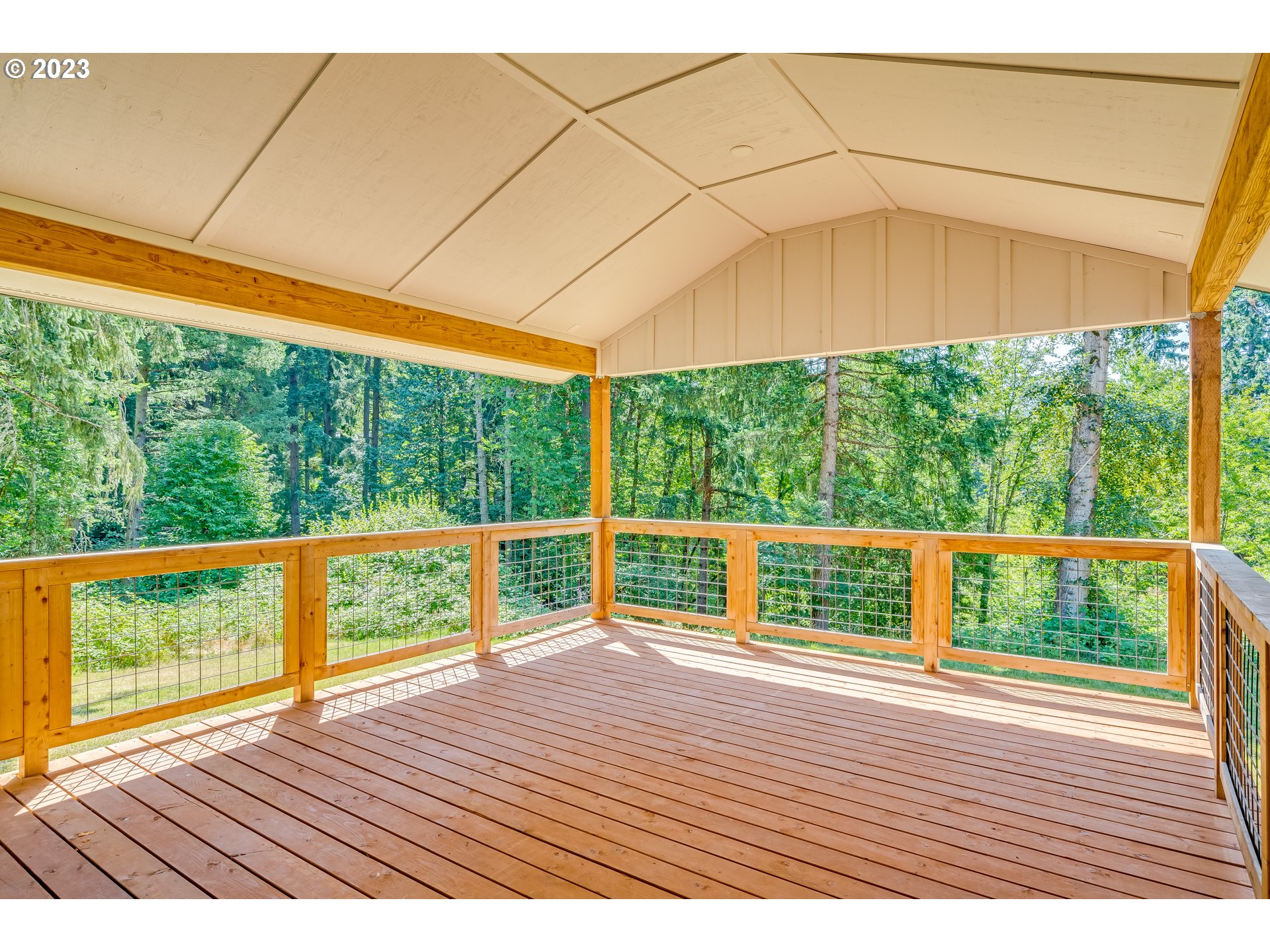 12840 South Carus Road Oregon City, OR 97045 - Photo 32 of 35 a porch with a wooden floor