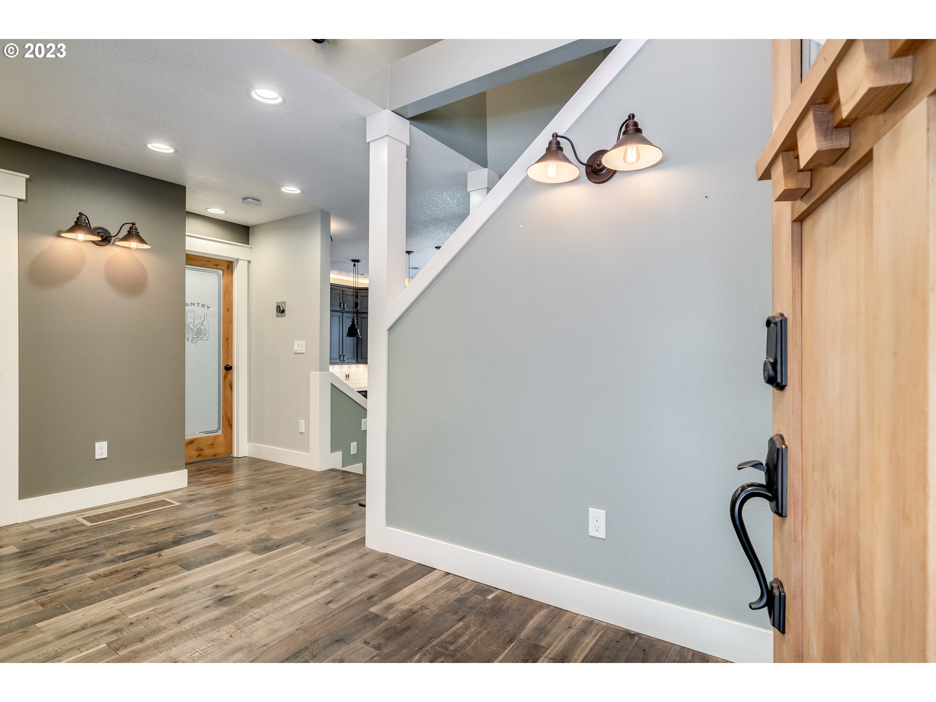 12840 South Carus Road Oregon City, OR 97045 - Photo 6 of 35 a view of a hallway with wooden floor