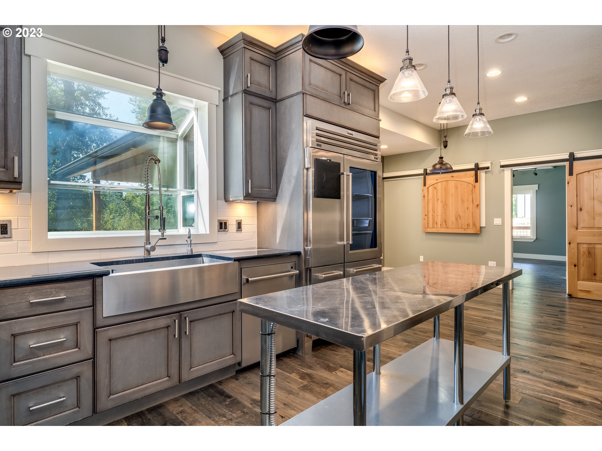 12840 South Carus Road Oregon City, OR 97045 - Photo 9 of 35 a kitchen with a sink cabinets and window
