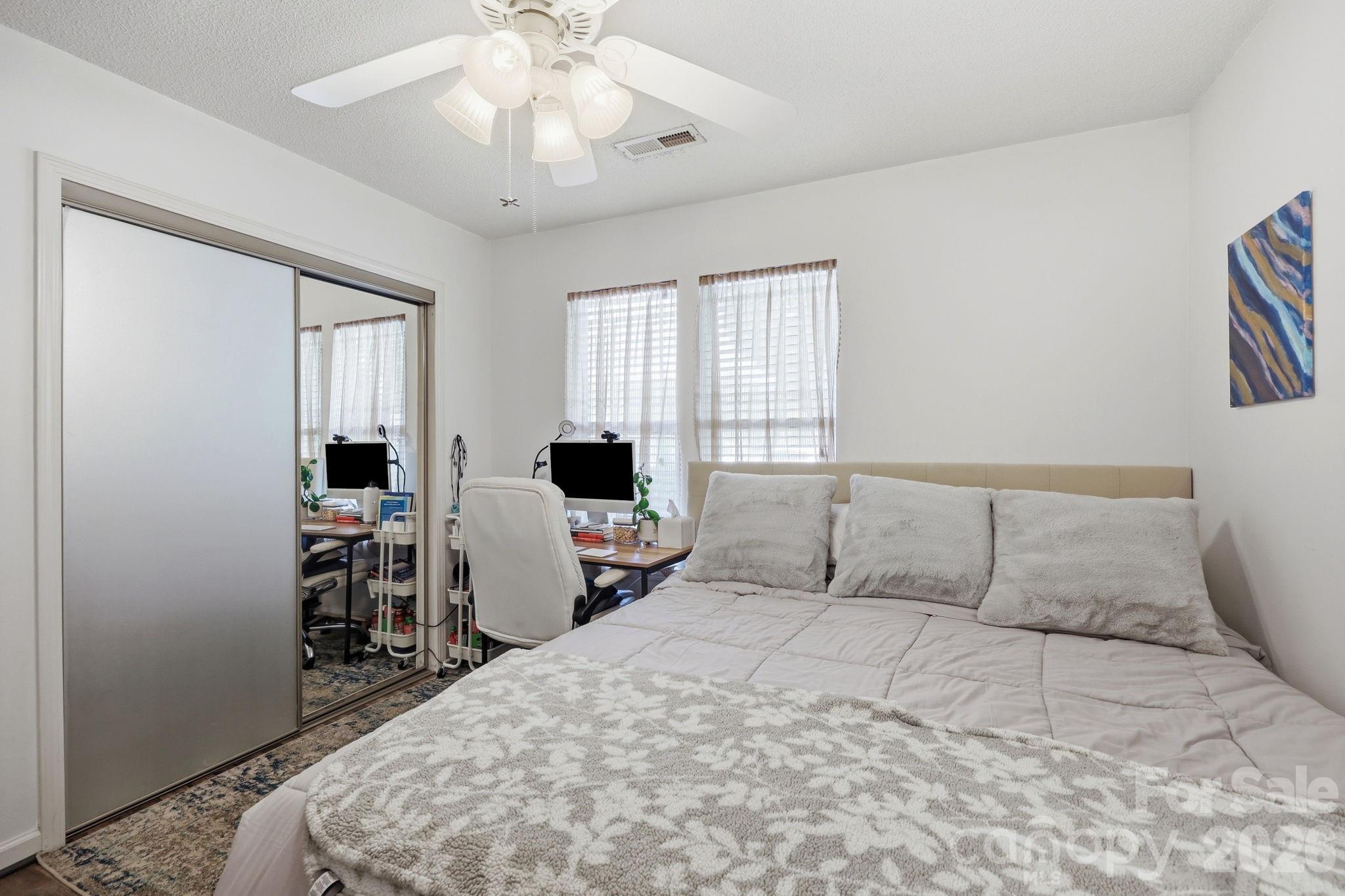 51 Sunview Circle Arden, NC 28704 - Photo 13 of 31 a bedroom with a bed and a flat screen tv