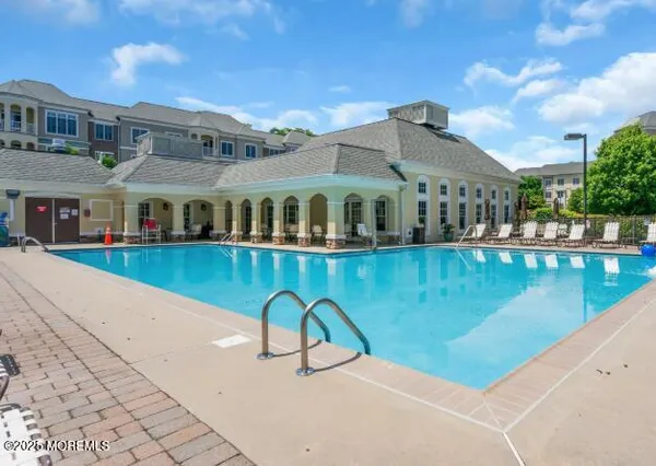 a view of a kitchen with a sink and wooden floor