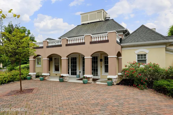 a kitchen with kitchen island a sink stainless steel appliances and cabinets
