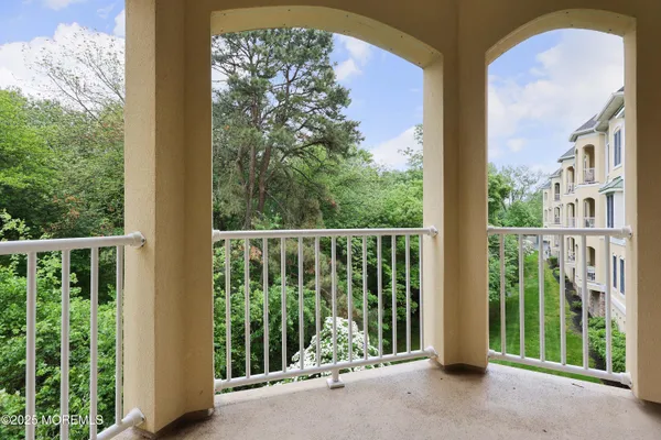 a kitchen with stainless steel appliances a sink a stove and cabinets