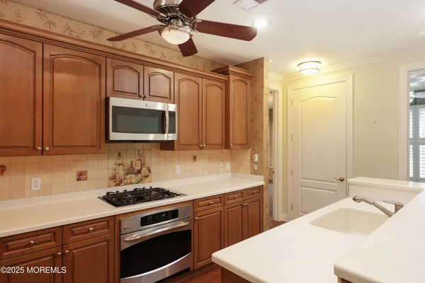 a bathroom with a double vanity sink mirror and shower