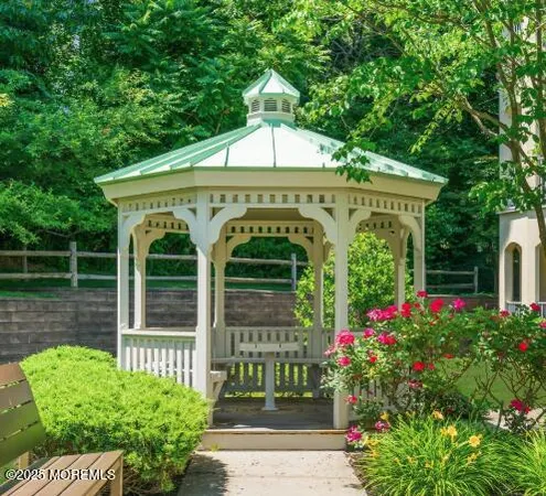 a front view of a residential apartment building with a yard