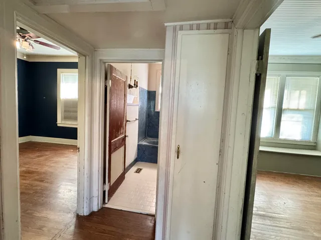 a view of a bathroom with a glass door shower and a sink