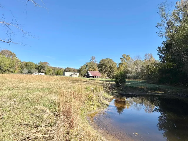 a view of lake with green space
